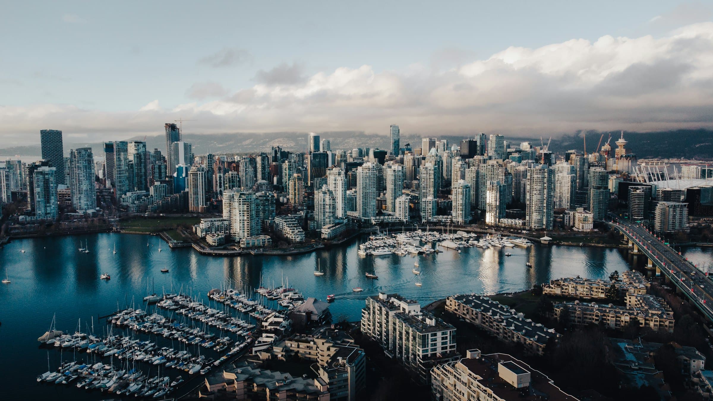 Aerial view of the Vancouver skyline and False Creek, with presale condo towers under construction