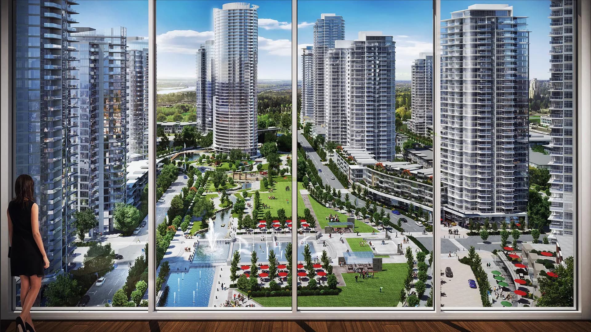 Southgate City – The view from inside a high-rise unit looking through floor-to-ceiling windows down at surrounding residential towers and a landscaped public plaza with a fountain.