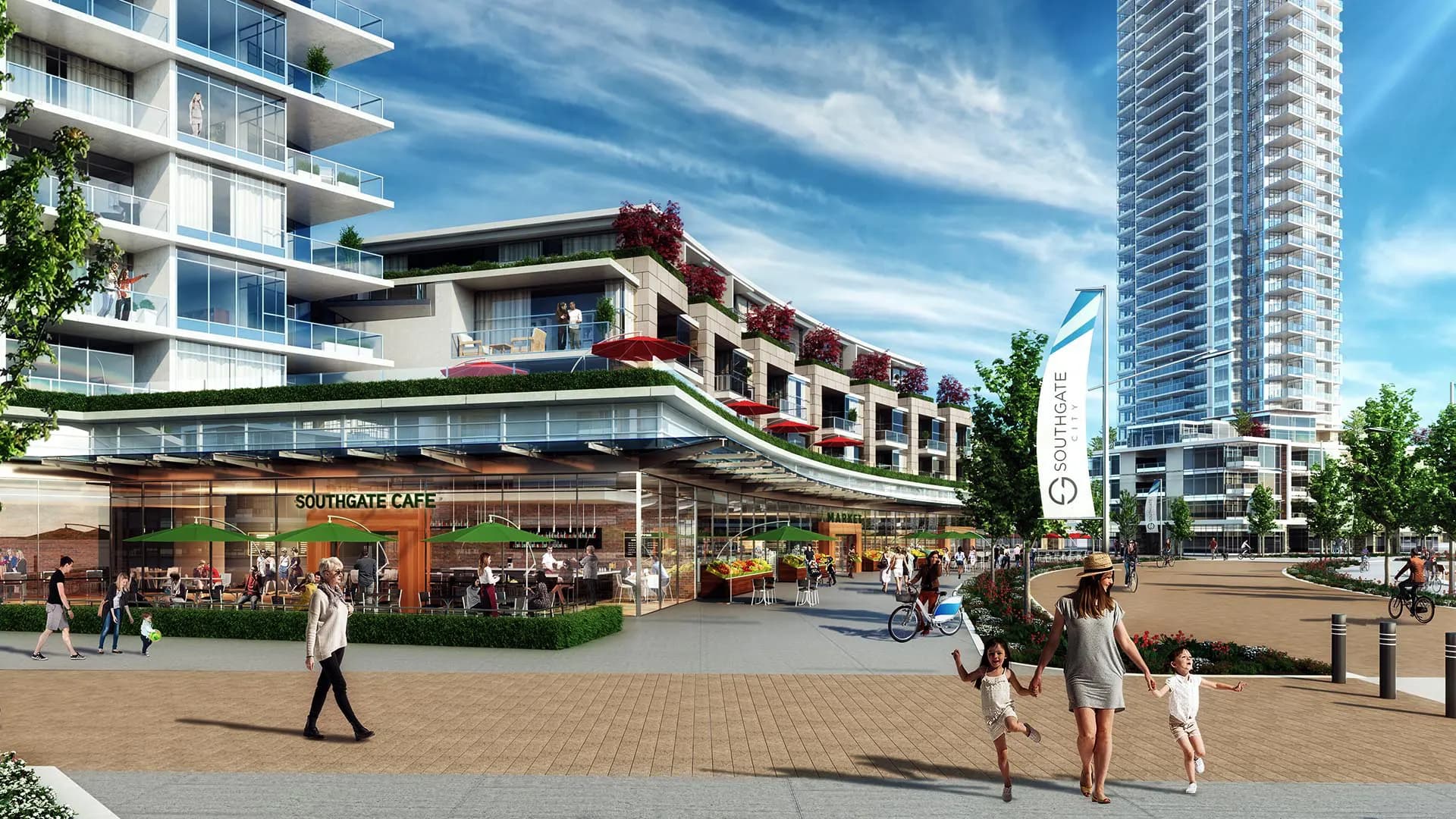 Southgate City – Street-level view of a retail podium beneath residential towers, showing the Southgate Cafe patio with umbrellas, a market storefront, and pedestrians and cyclists on the plaza.