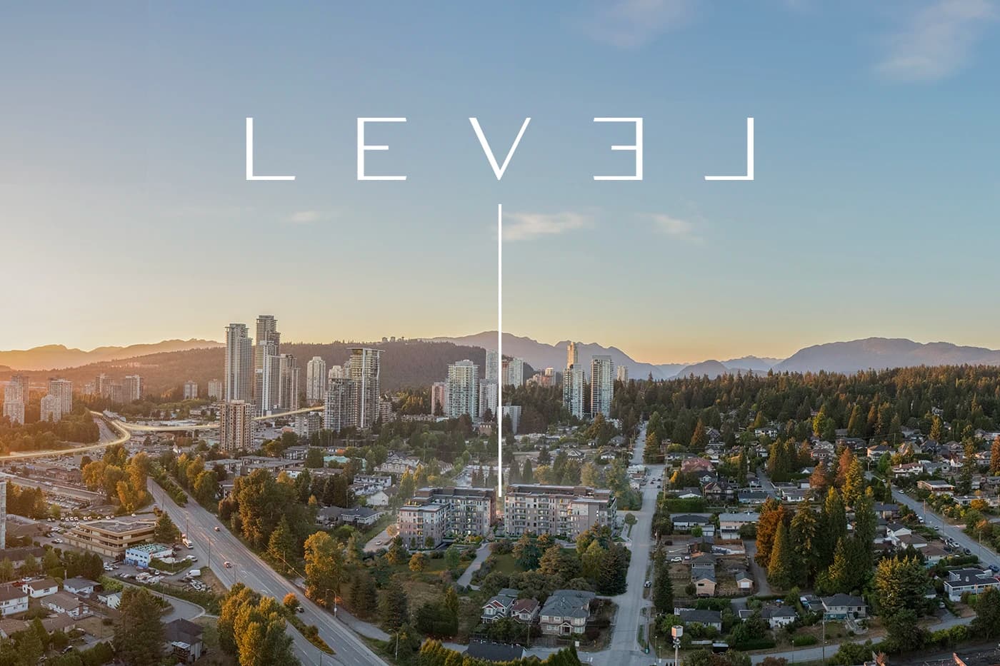 Level – An elevated aerial view at golden hour showcasing a mid-rise residential building complex nestled among lush trees and suburban streets. In the distance, clusters of high-rise towers stand against rolling hills and a mountain range under a clear sky.