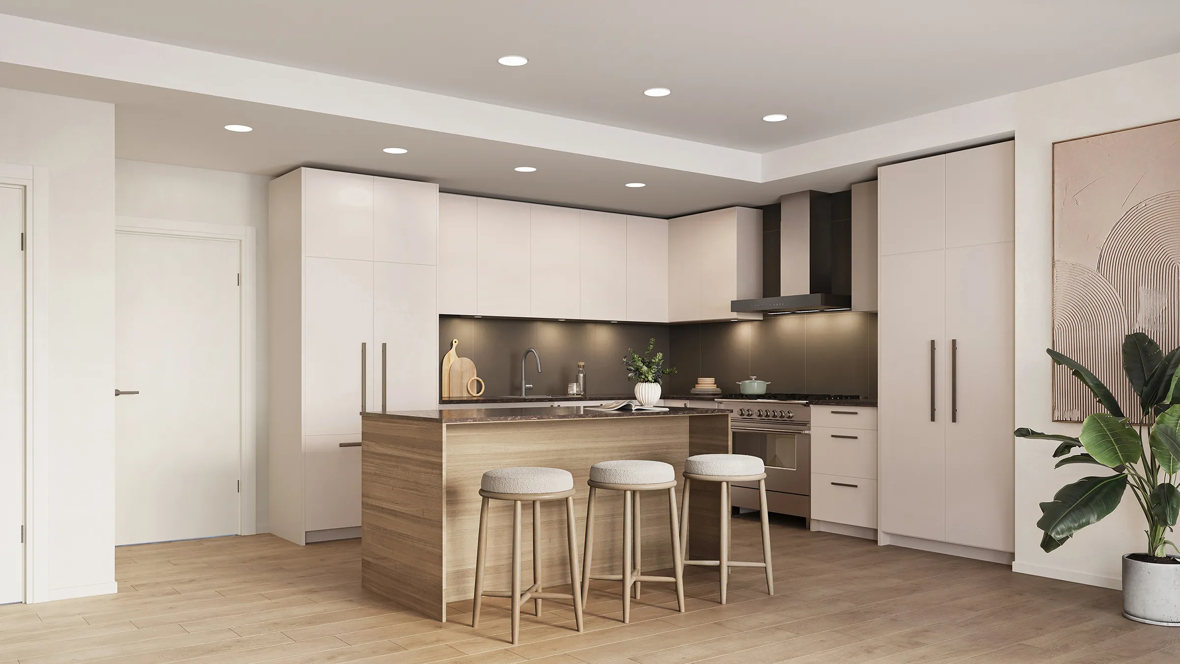 Bridge & Elliott – A modern, open-concept kitchen features minimalist flat-panel cabinetry in off-white alongside a light wood kitchen island with three upholstered round barstools. Stainless steel appliances, a dark backsplash with under-cabinet lighting, light hardwood floors, and a potted leafy plant create a clean, contemporary aesthetic.