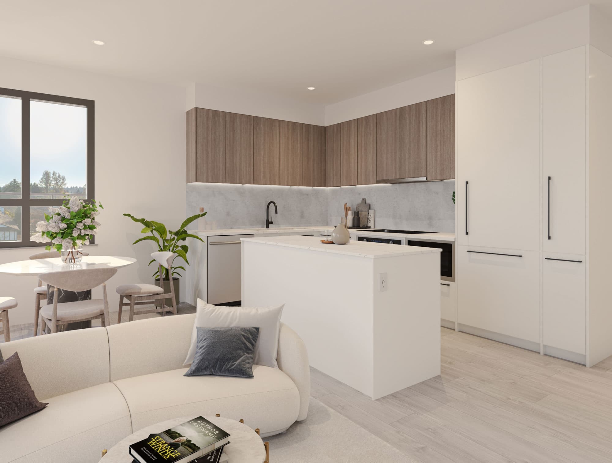 Véra – An open-concept living room and kitchen with a wood-paneled kitchen, white island, and a beige sectional sofa with a window view of trees.