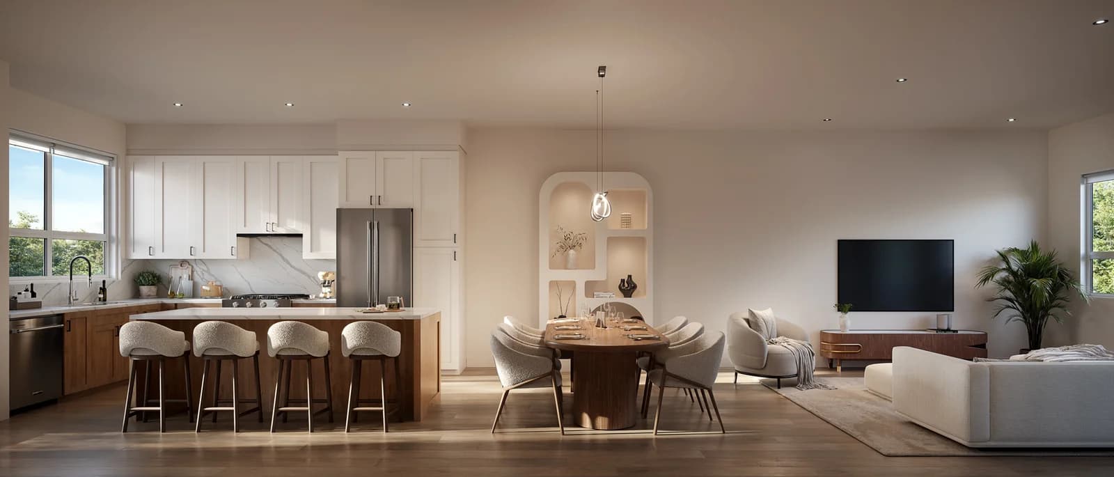 Regent Place – Open-concept kitchen, dining, and living room with white cabinetry, a wood island, and a round dining table.