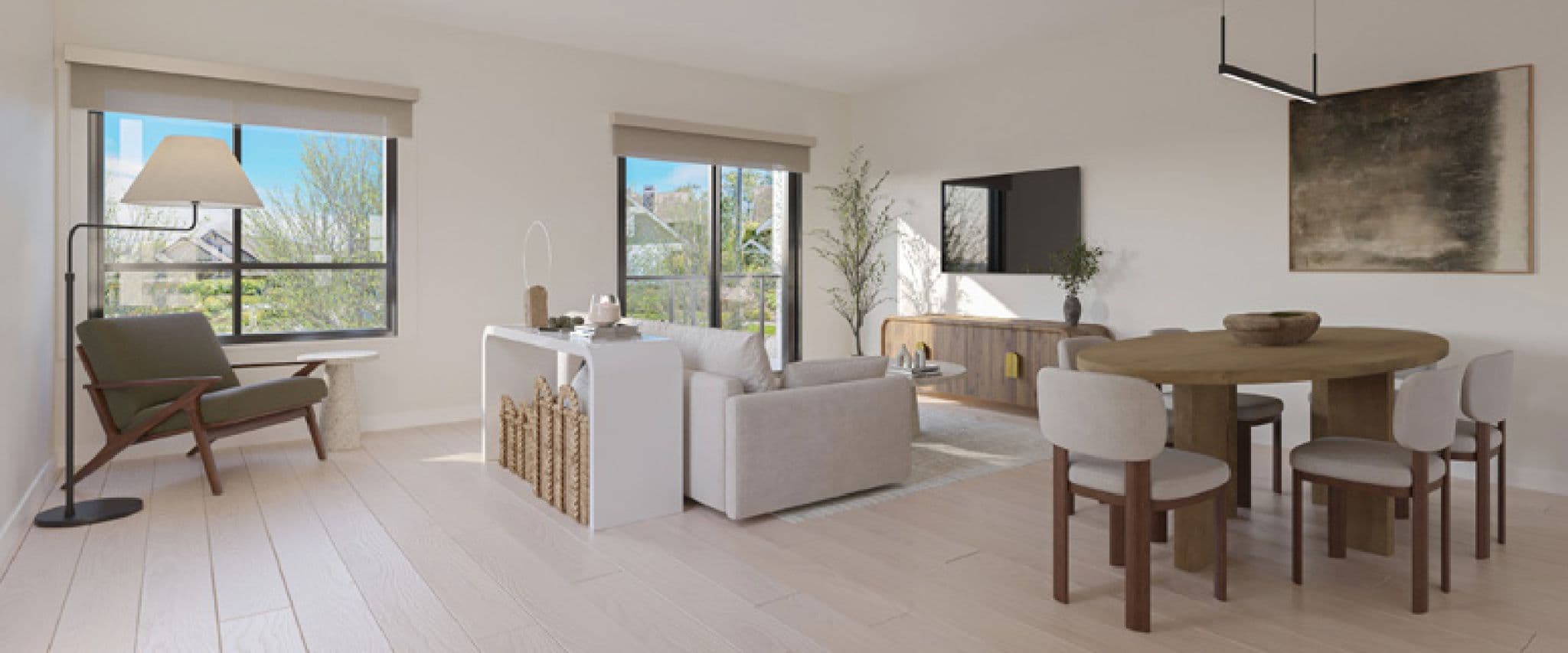 Nature's Walk – Living and dining room with a sofa, wood round dining table seating six, TV console, and windows showing neighboring rooftops.