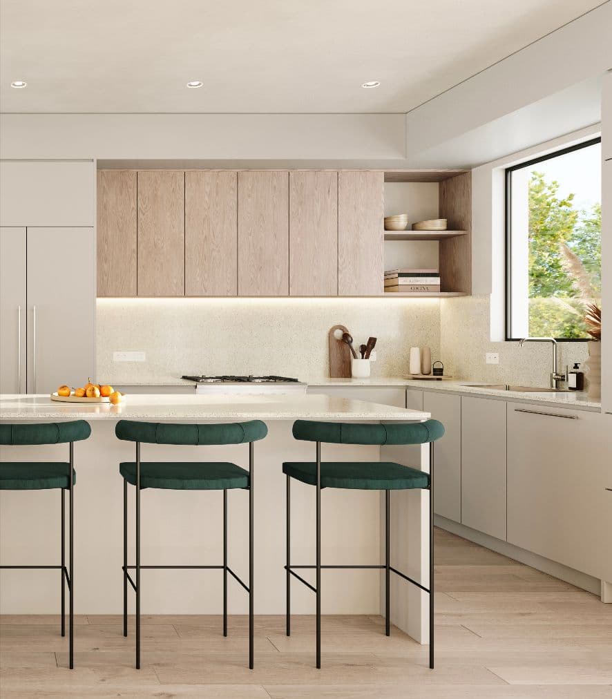 Rowen W47th – Kitchen island with green upholstered bar stools, light wood upper cabinets with open shelving, and a window view of trees.