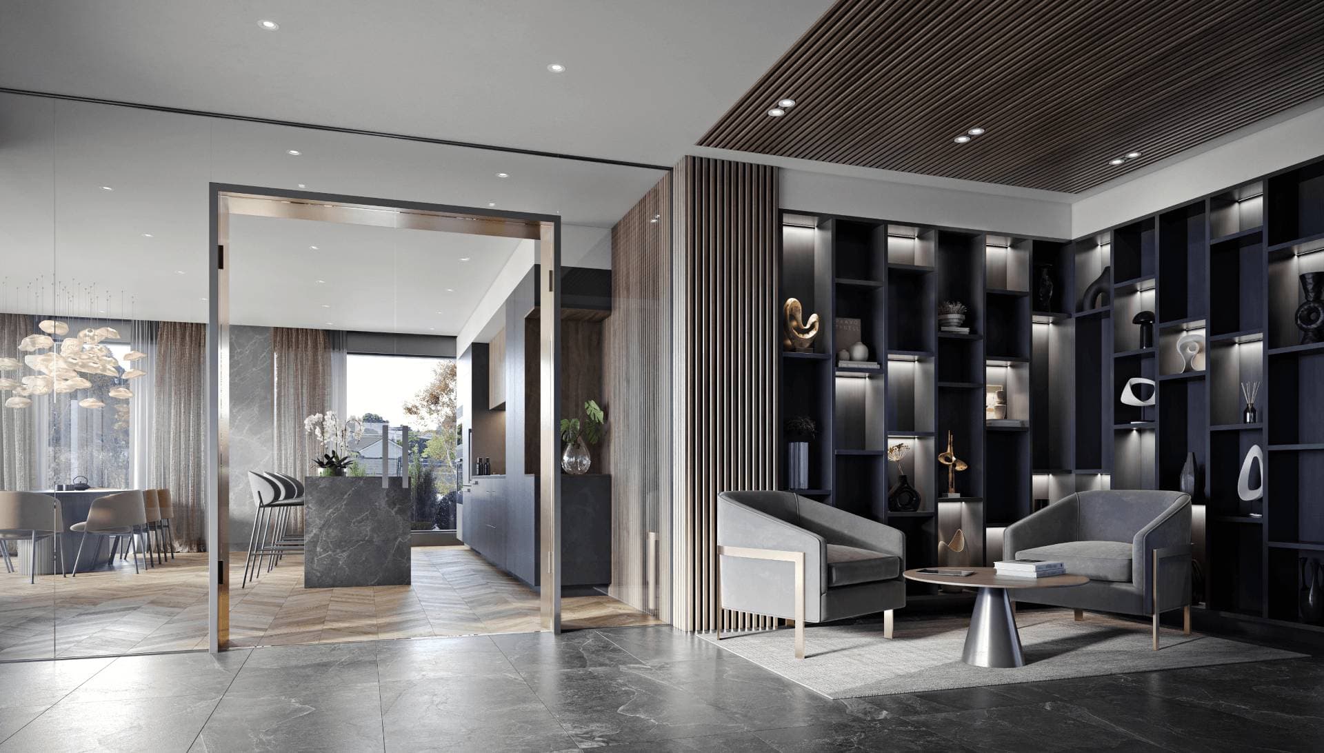 Fränk – A luxurious, modern indoor lounge and reception area featuring dark tile floors, slatted wood paneling, and two grey armchairs framing a small coffee table in front of floor-to-ceiling illuminated shelving. Glass doors and partitions open into an adjacent dining and kitchen area with chevron wood flooring, a marble island, and a chic chandelier.