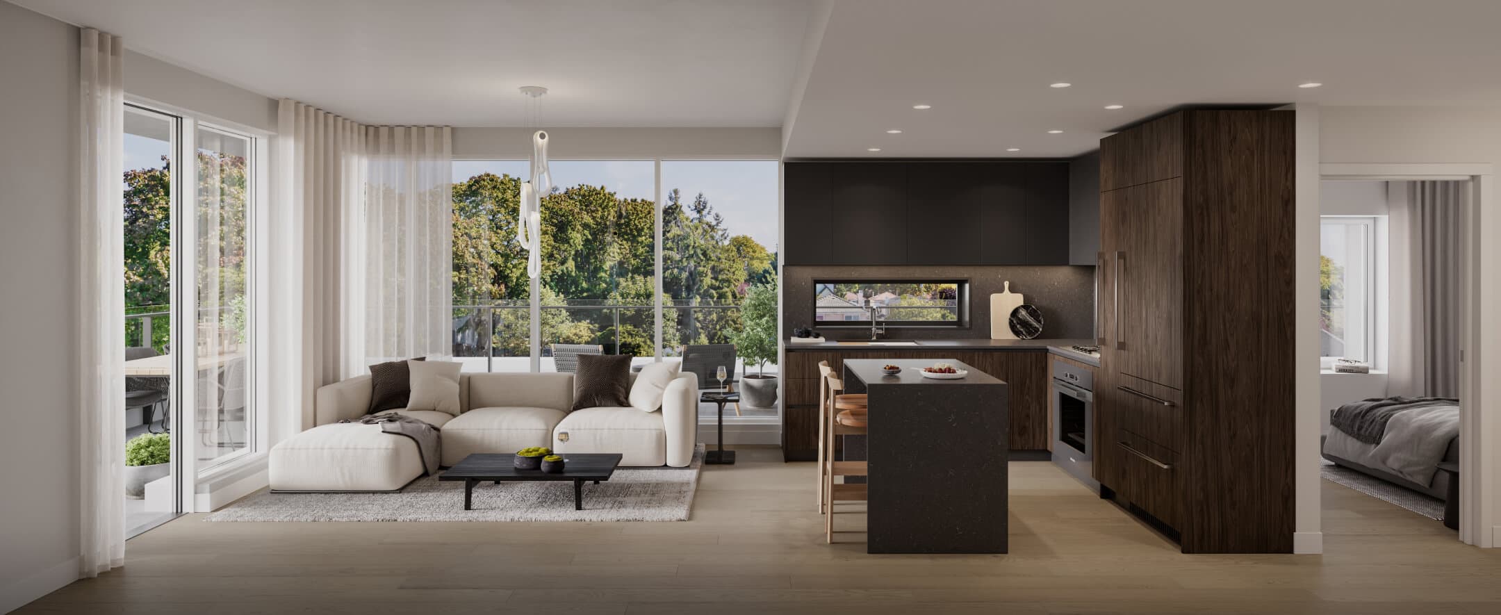 Fränk – An open-concept condo interior features a light-toned living room with a sectional sofa and a modern kitchen with dark wood paneling and a quartz waterfall island. Floor-to-ceiling glass sliding doors lead out to a balcony overlooking lush green trees.