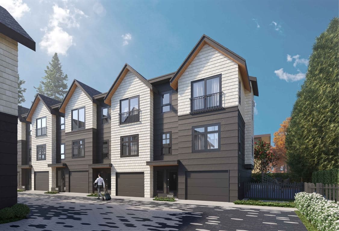 Sapperton – Daytime street view of townhomes with light shingle siding, gabled rooflines, and dark garage doors, one person walking with luggage.