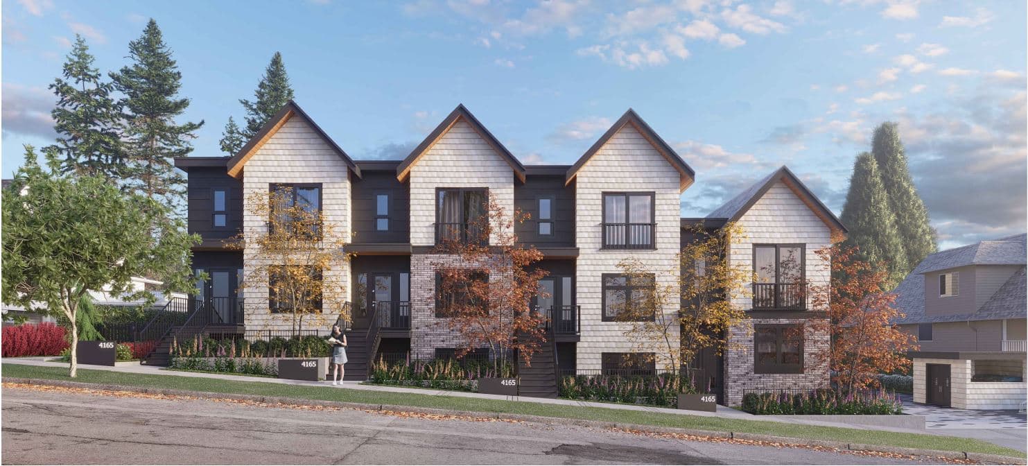 Sapperton – Dusk view of a row of gabled townhomes with autumn-toned trees and a person standing at the entrance walkway.