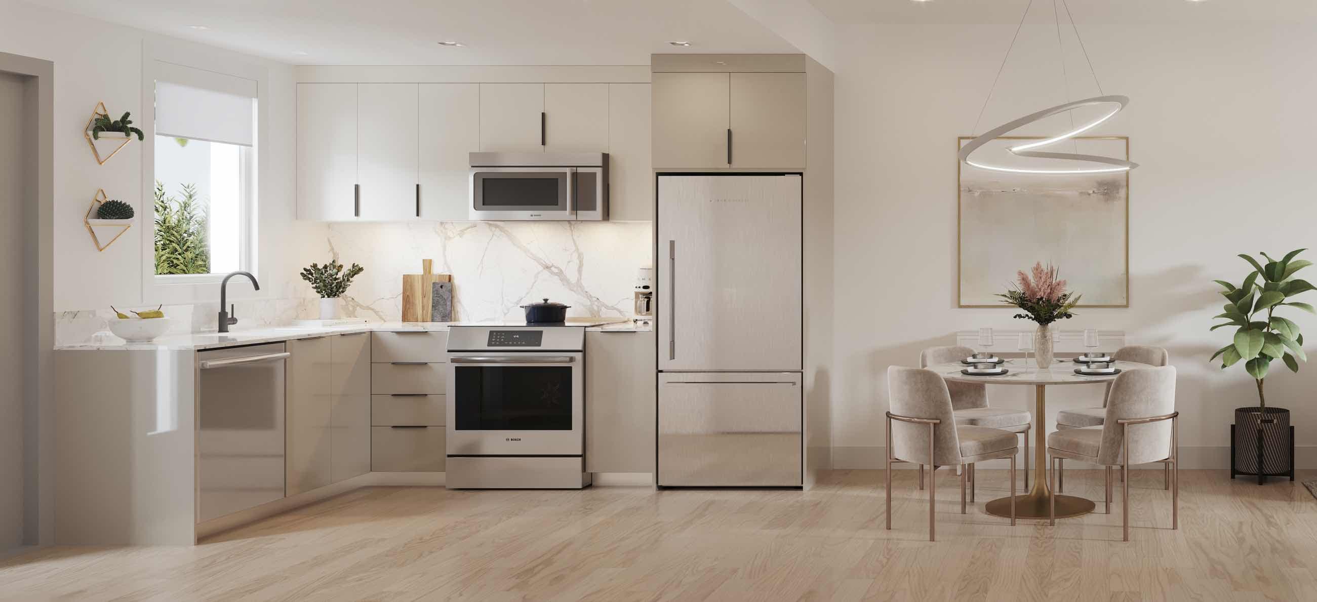 Templeton – A kitchen and dining area with stainless steel appliances, light cabinetry, and a round dining table with upholstered chairs.