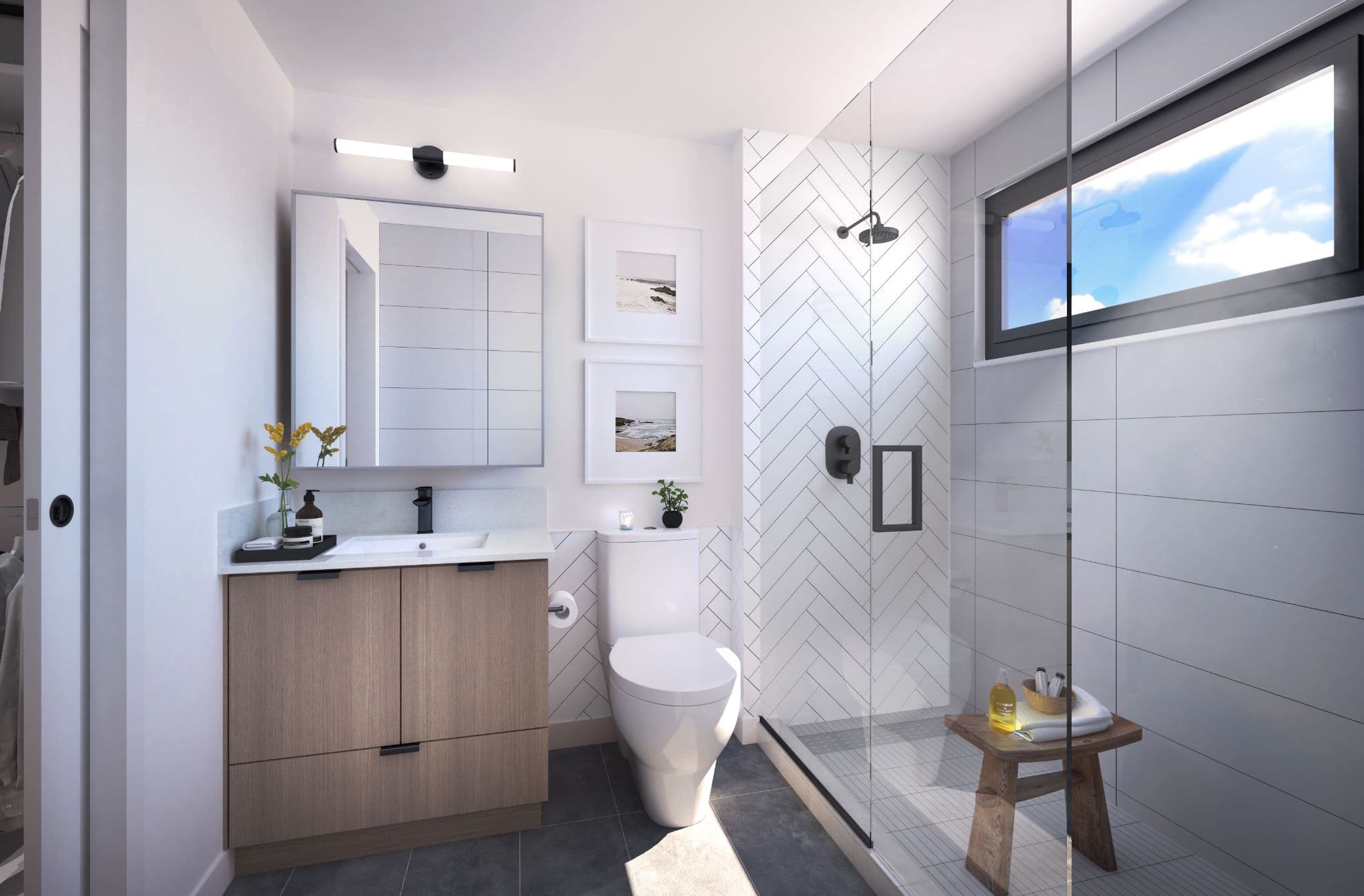 Laurel on Mill Lake – Rendering of a bathroom with a wood vanity, large mirror, framed beach photos, and a glass-enclosed walk-in shower with herringbone tile.
