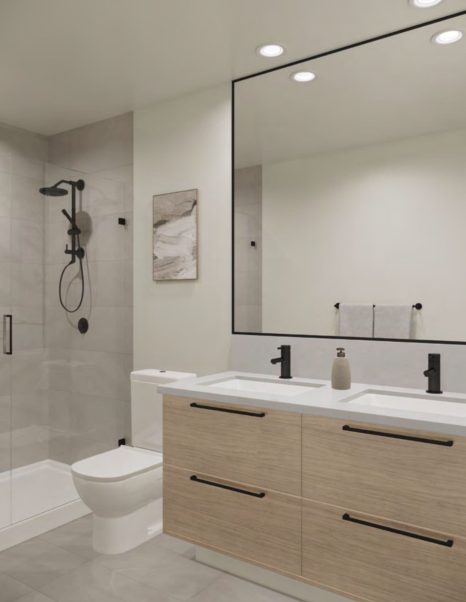 JEM Condos – Bathroom with a glass-enclosed shower, black fixtures, a floating wood vanity with double sinks, and a framed abstract print.