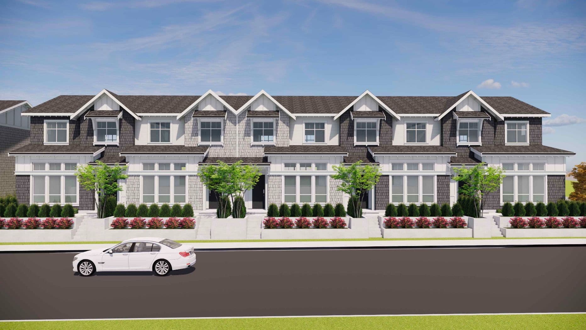 Ocean Park – A street-level architectural rendering shows a row of modern two-story townhomes with grey and white shake siding, white window trim, and gabled roofs. Landscaped front gardens with low retaining walls, small trees, and bright pink flowers line the sidewalk, with a single white sedan parked on the road in front under a clear blue sky.