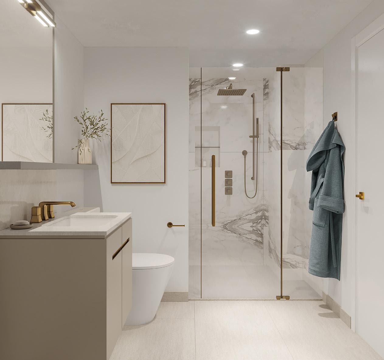Italia – A bathroom with a glass-enclosed marble shower, brass fixtures, a robe hanging on a hook, a toilet, and a vanity with brass faucets and framed art on the wall.