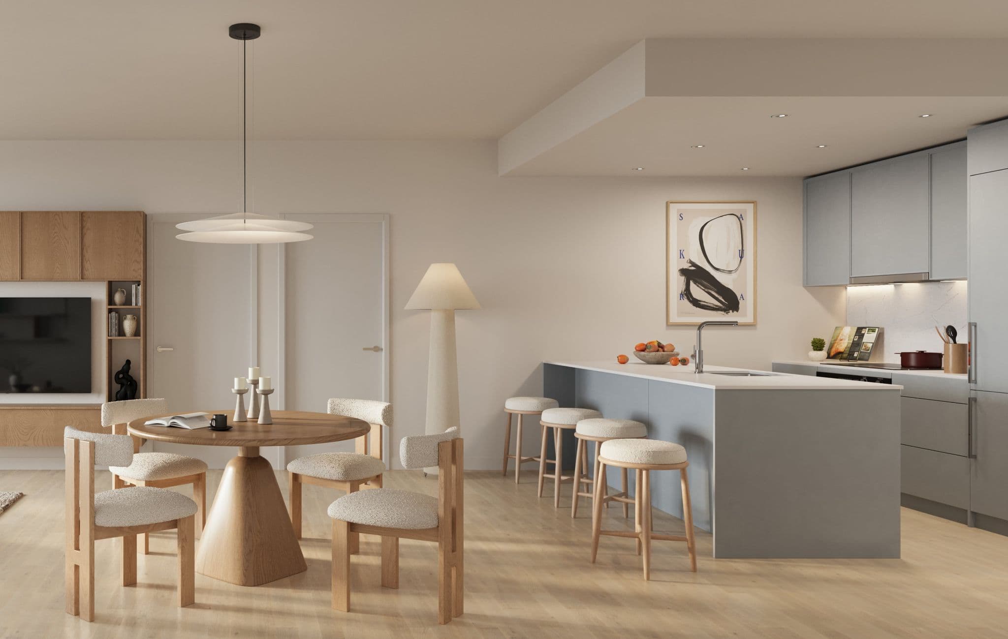 Kwasen Village – Open-concept dining and kitchen area with a round wood table and boucle chairs, pendant lighting, a wall-mounted TV console, and a gray kitchen island with bar stools.