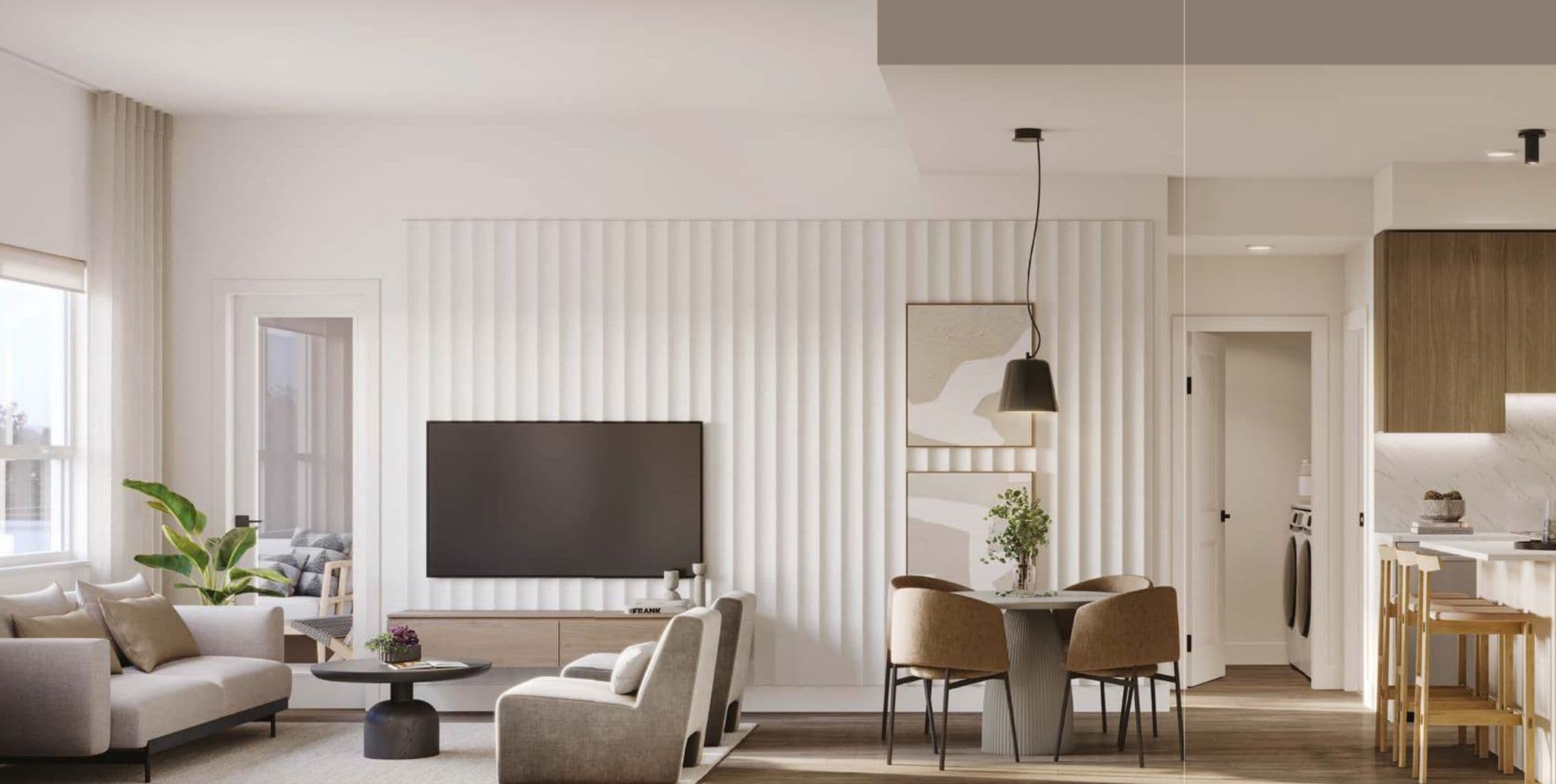 Eden – Open-concept living and dining area with a fluted TV accent wall, round dining table with rust-colored chairs, and kitchen visible beyond.