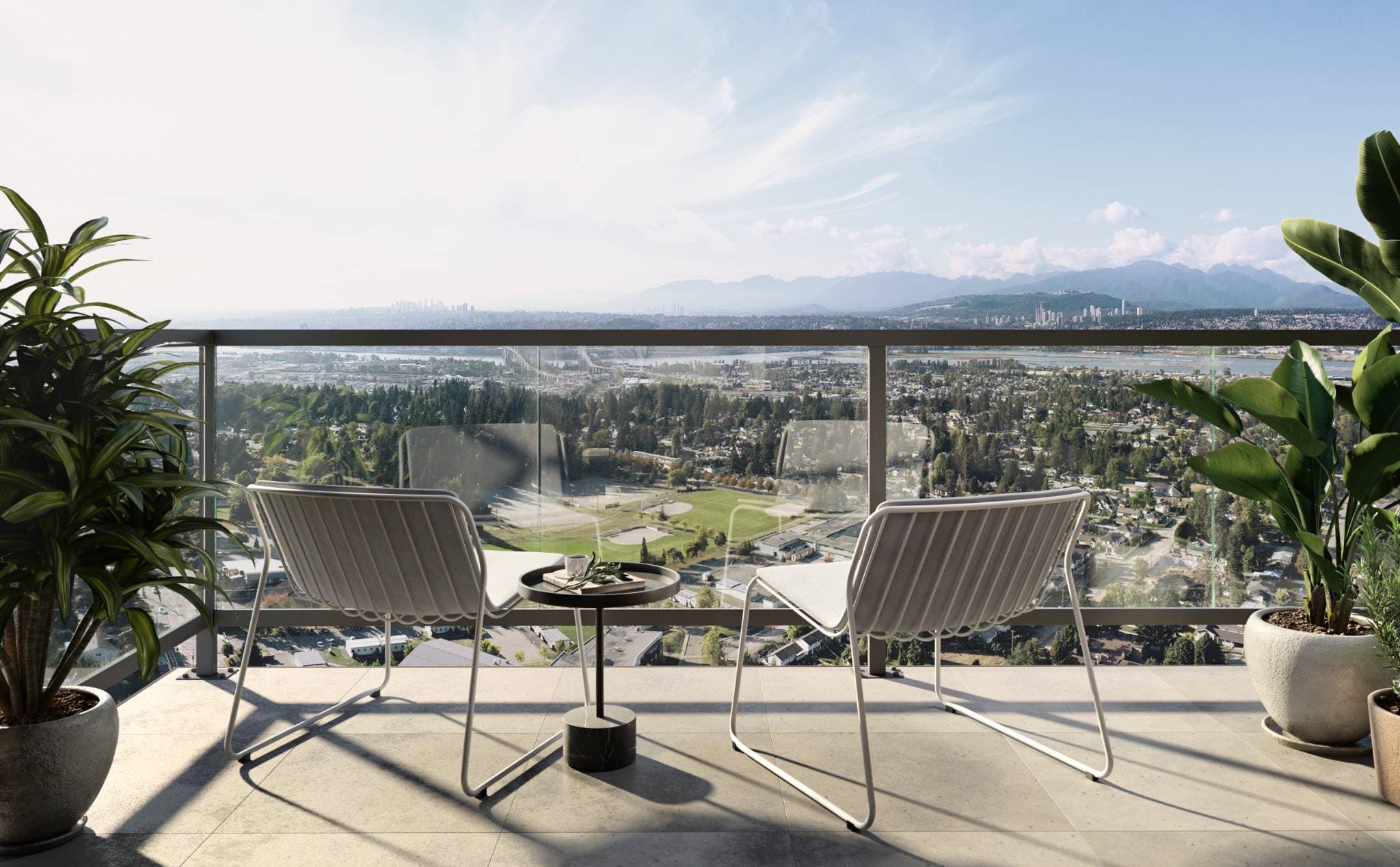 Sequoia – A high-rise balcony with glass railings, modern seating, and potted plants overlooks an expansive daytime panorama of a lush suburban landscape, river, distant city skyline, and mountains.