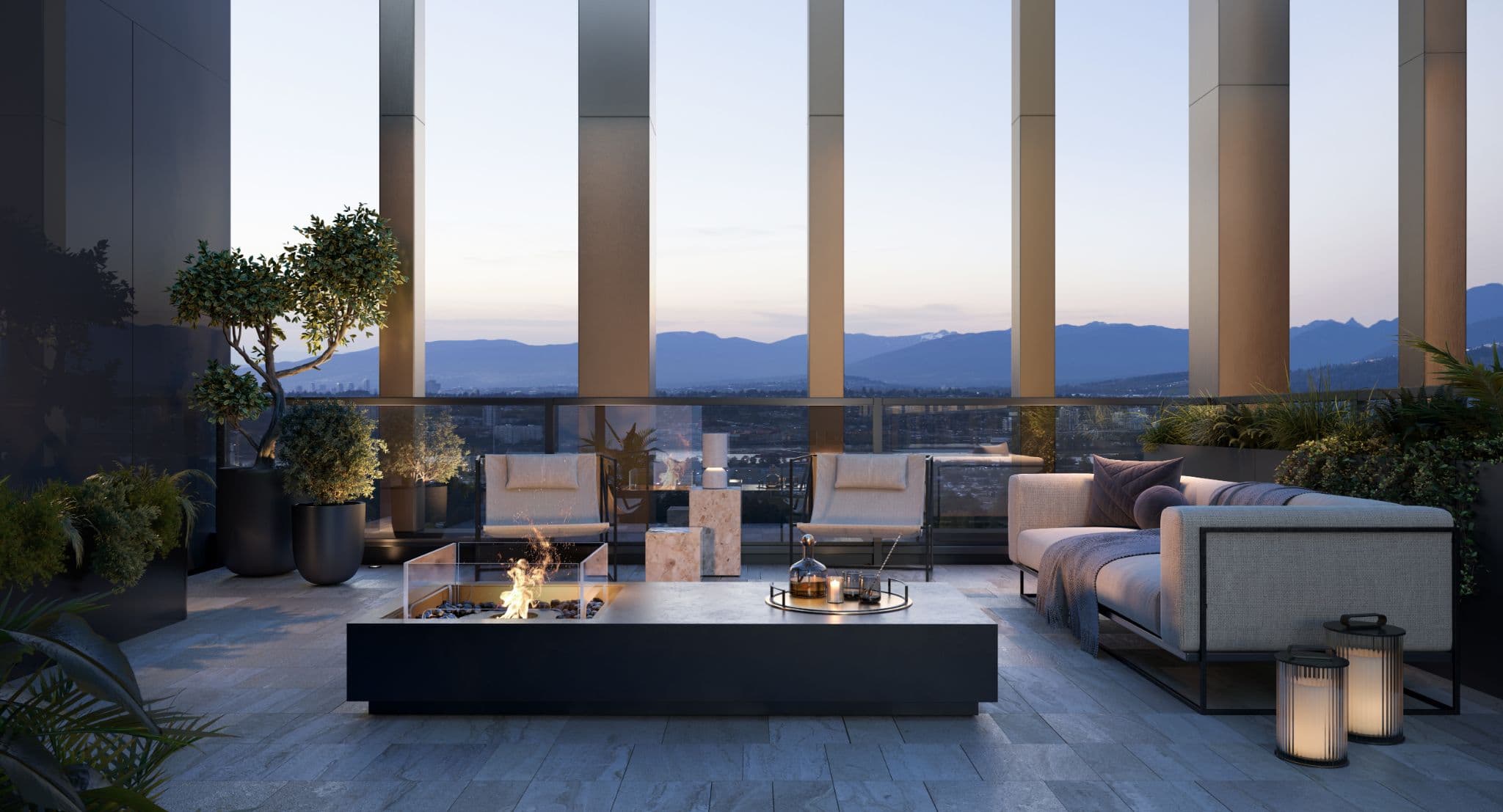 Sequoia – A high-rise outdoor terrace lounge at dusk featuring contemporary sofas, armchairs, and a lit rectangular fire pit table. Framed by tall architectural columns and glass railings, the space overlooks an expansive panoramic view of a city and distant mountain range.