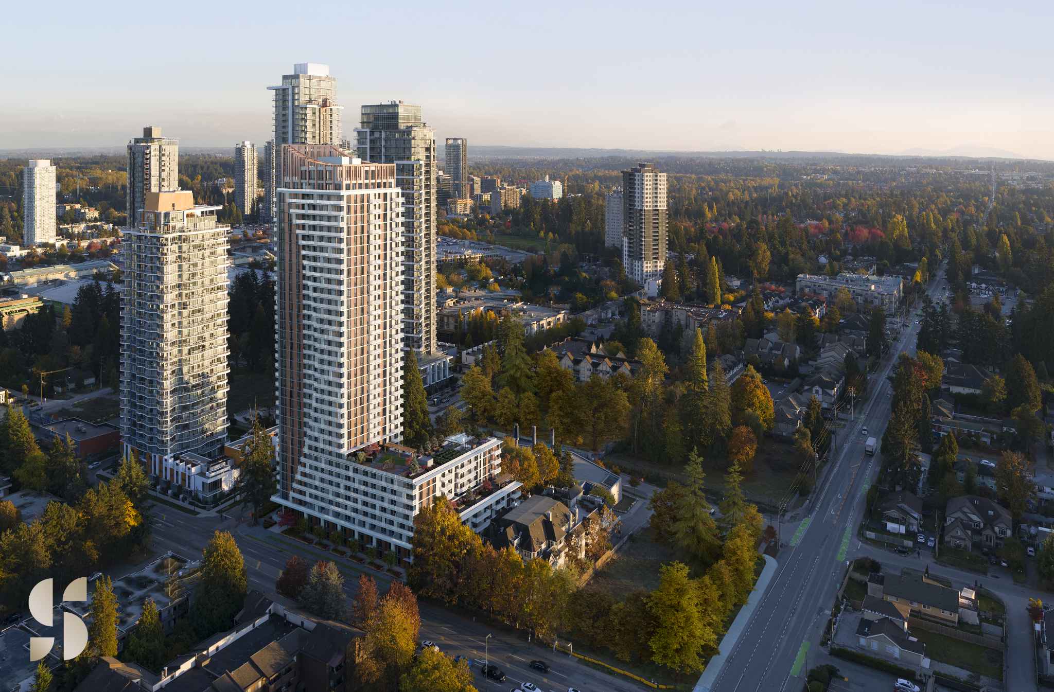 Sequoia – High-angle aerial render showing a cluster of modern residential high-rise towers nestled among tree-lined streets and low-density housing during golden hour.