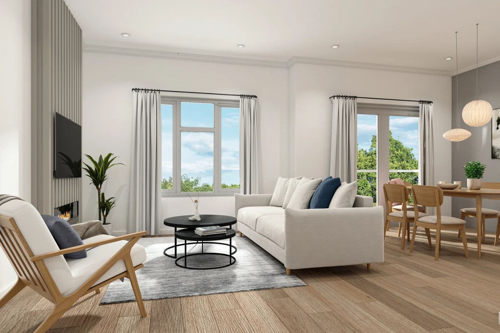 Finestra – An open living and dining area with a beige sofa, area rug, dining table with wood chairs, and large windows to a green yard.