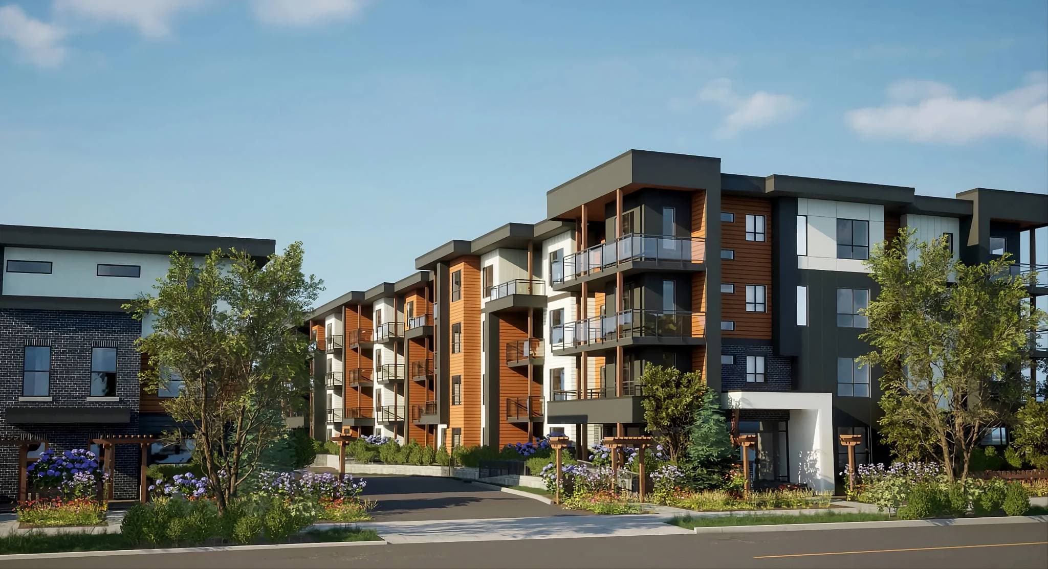 Kensington Gate – A five-story condo building with orange wood-panel accents and dark cladding, photographed street-level in daylight with landscaped entry gardens.