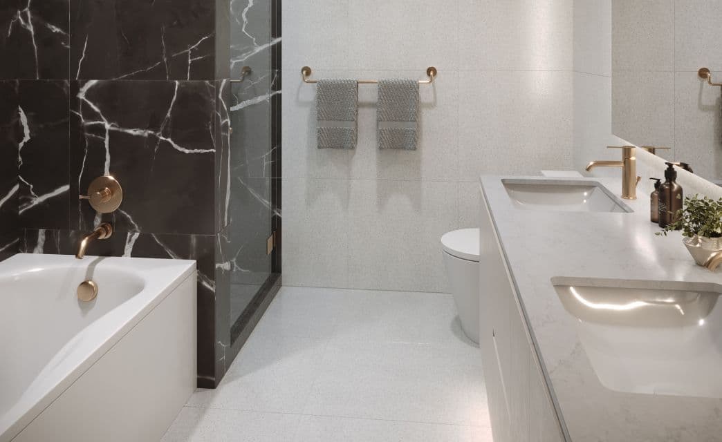Gryphon Nova Condos – A bathroom rendering with a black marble feature wall, a glass shower enclosure, a soaker tub with gold fixtures, and a white double vanity.