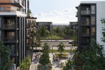 Azure Grove – Elevated courtyard view between residential buildings showing outdoor seating and garden planters.