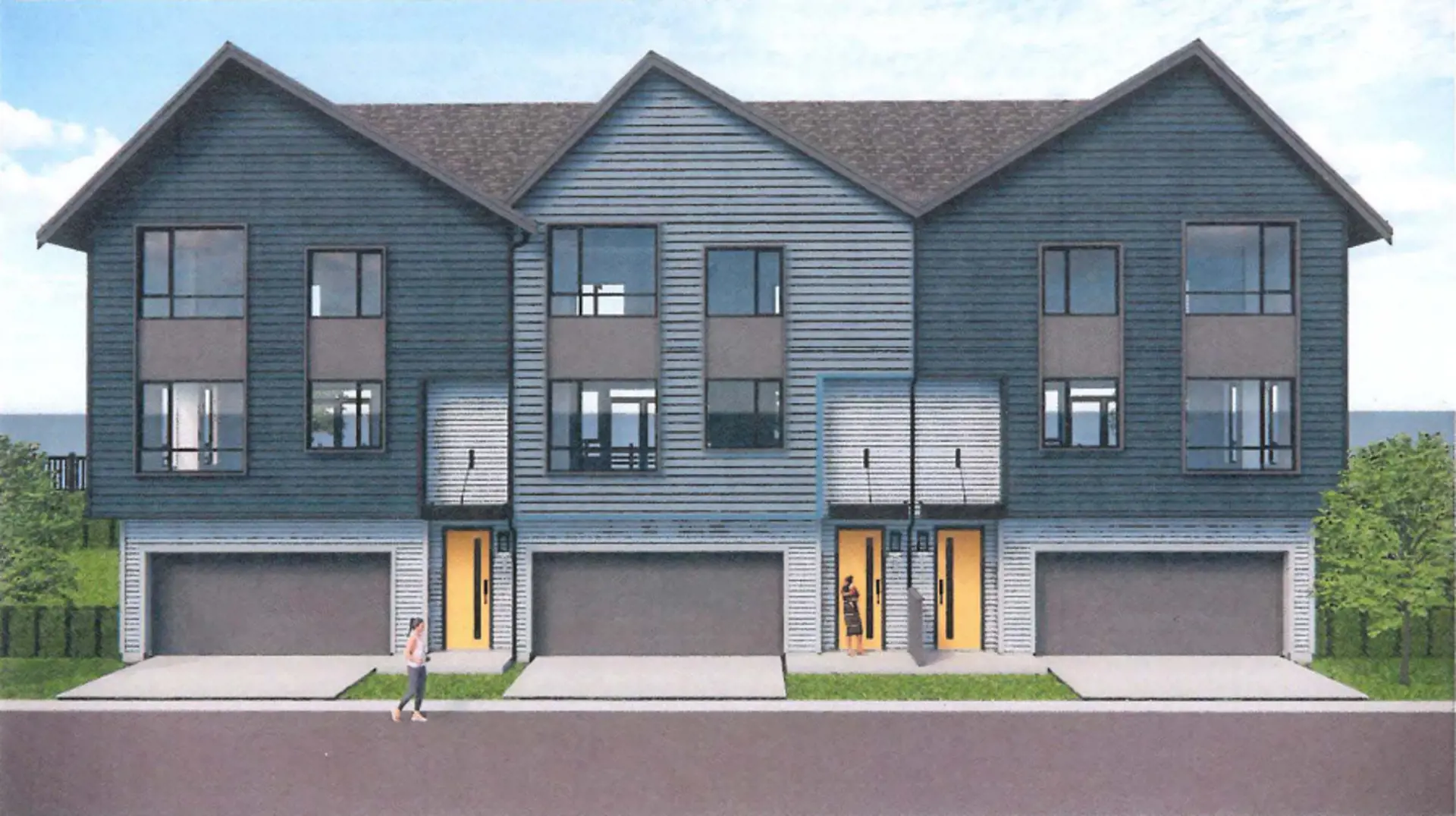 Beaumont – A row of three-story townhomes with dark blue-gray siding, orange front doors, and attached garages, along a residential street with a person walking.