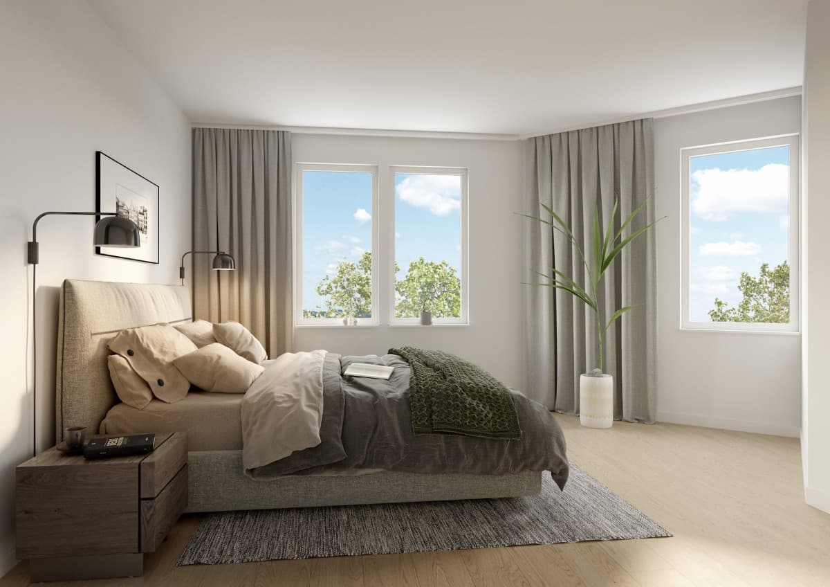 Montvue – Bedroom with an upholstered bed, wood nightstands, wall sconces, a potted plant and two large windows showing treetops and sky.