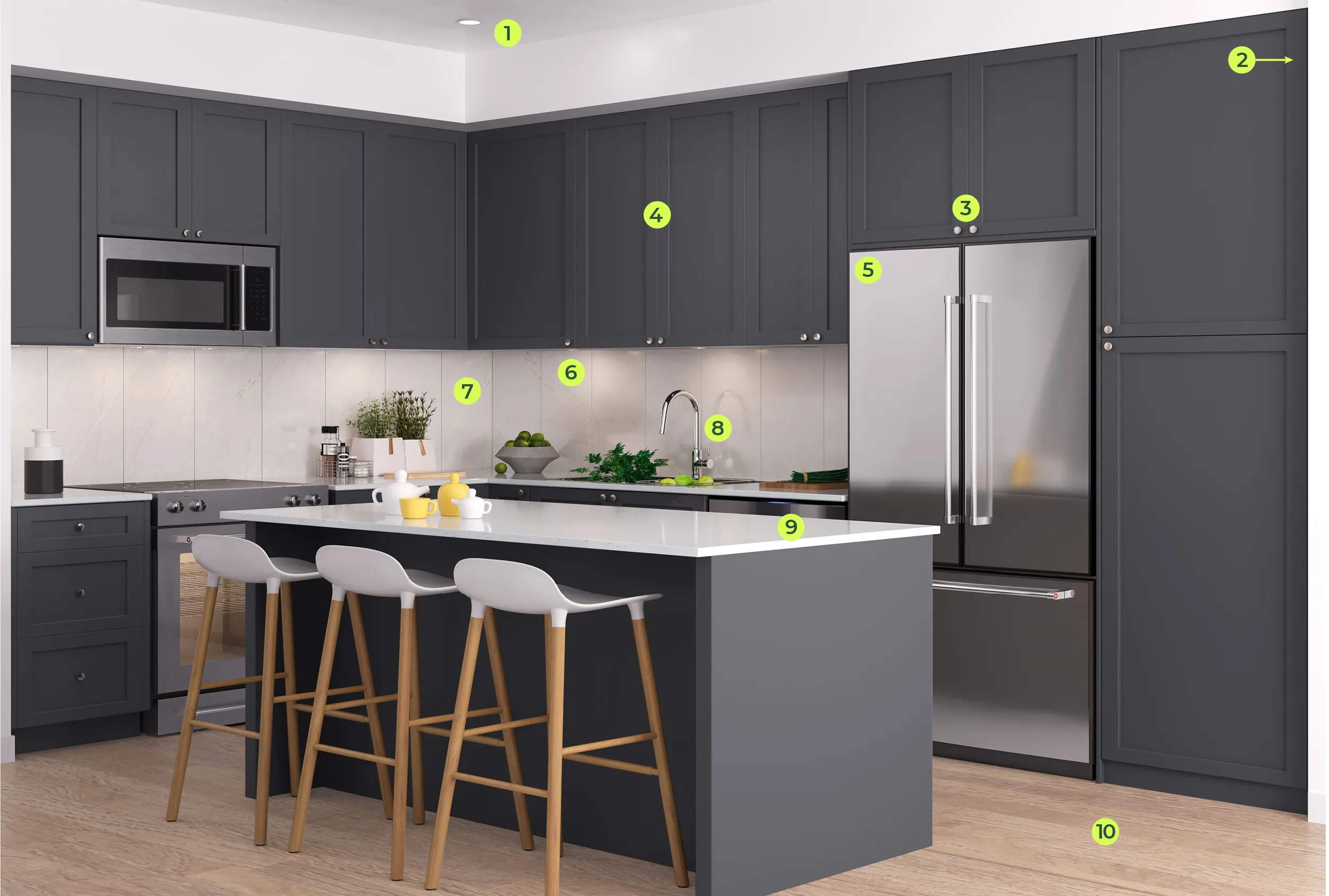 Queens Townhomes – A modern kitchen interior featuring dark charcoal-gray shaker cabinetry, white quartz countertops, and stainless steel appliances. A central kitchen island is paired with three white barstools featuring wooden legs against light natural wood flooring.