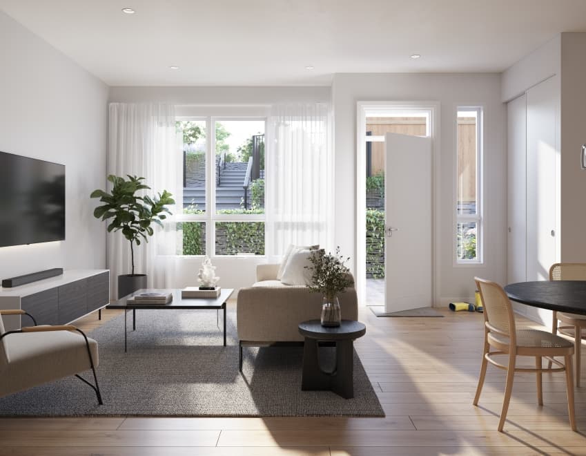Florin – Living and dining room with beige sofa, TV console, round dining table, and a door open to a fenced patio area outside.