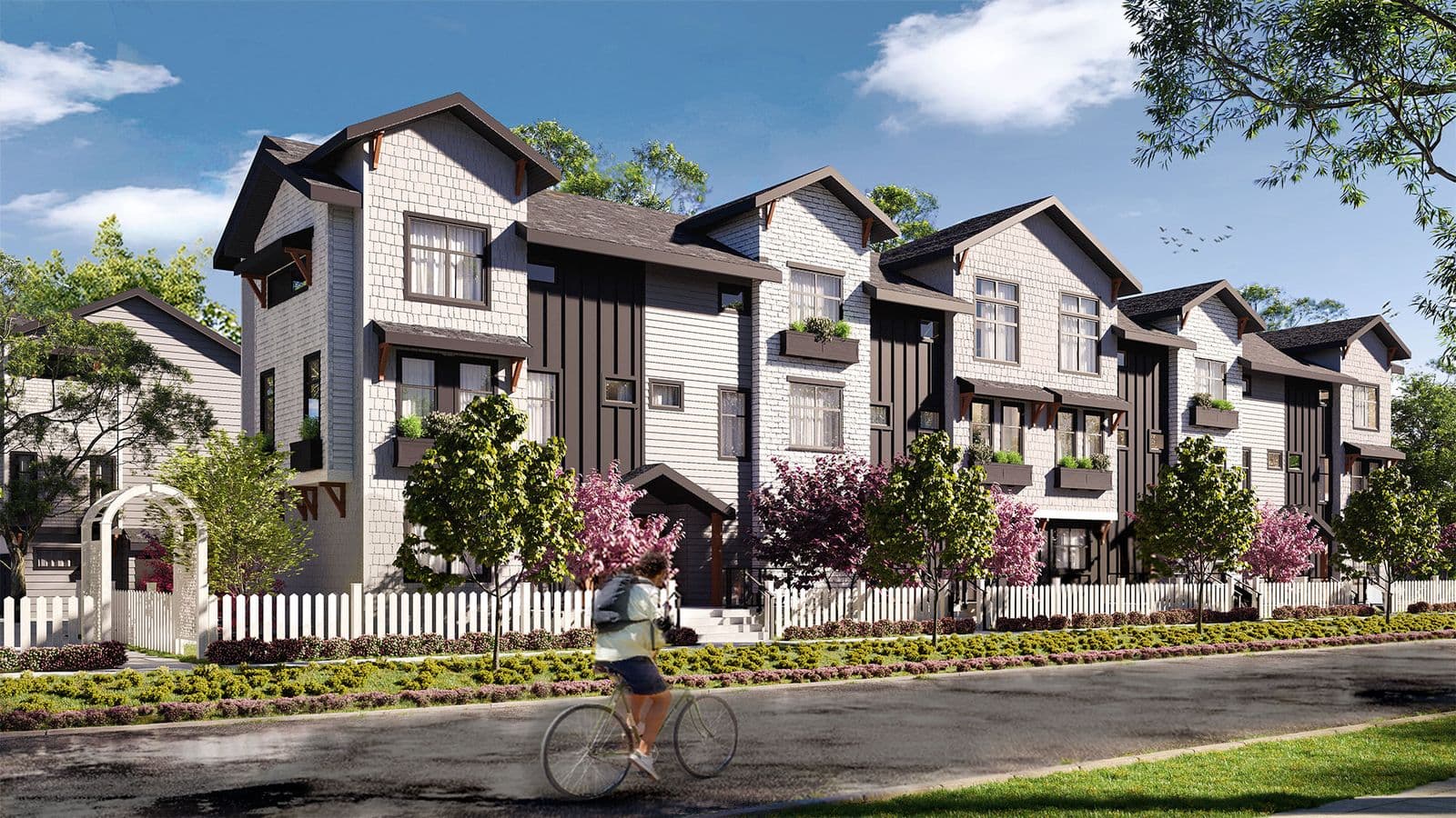 Gordon Square – Rendering of a row of craftsman-style townhomes with shingle siding, gabled roofs, and flower boxes, with a cyclist passing on the street.