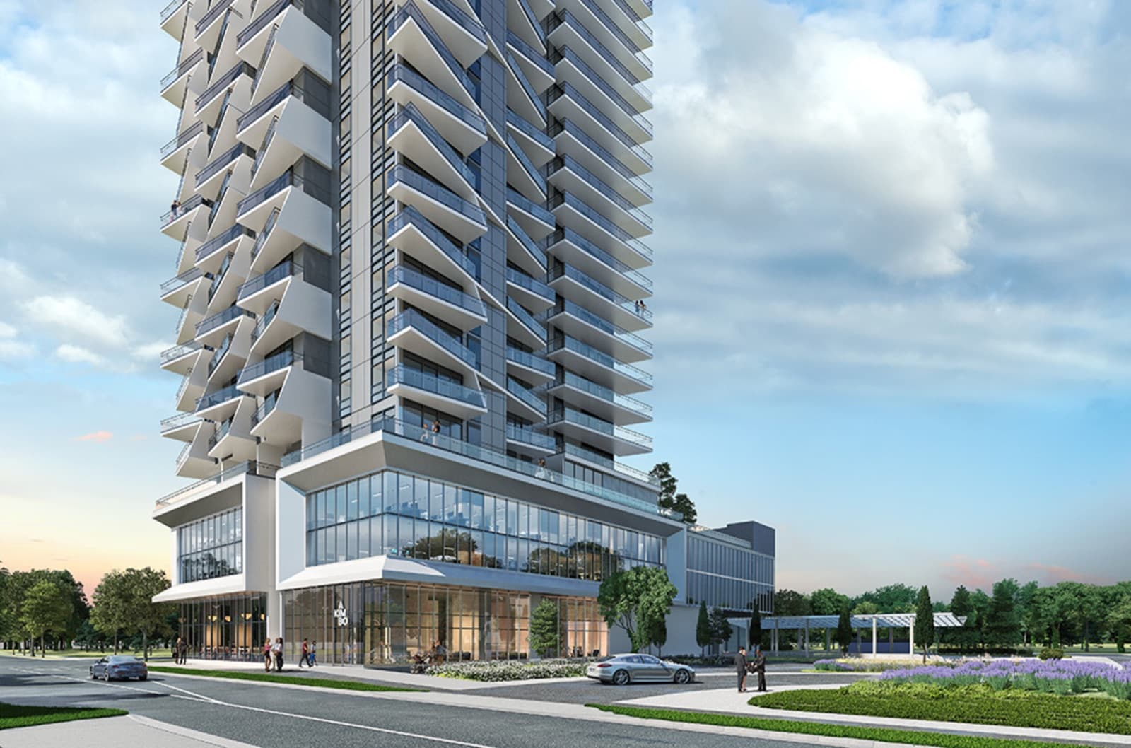 Akimbo Condos – A street-level view of the tower's glass podium entrance with the AKIMBO sign, people walking, cars parked, and landscaping out front.
