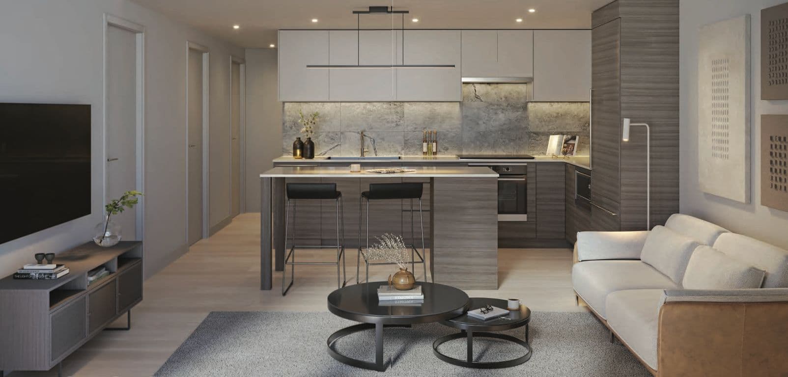 Juno Condos – Open-plan kitchen and living area in a dark woodgrain scheme with a marble backsplash, island with bar seating and a neutral sofa.