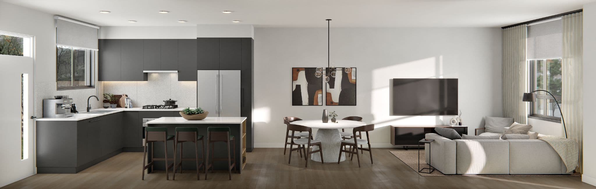 The Grove – A wide panorama of the same open-concept layout shown with dark charcoal-grey kitchen cabinetry instead of white, plus the round dining table and living room with sectional and TV.