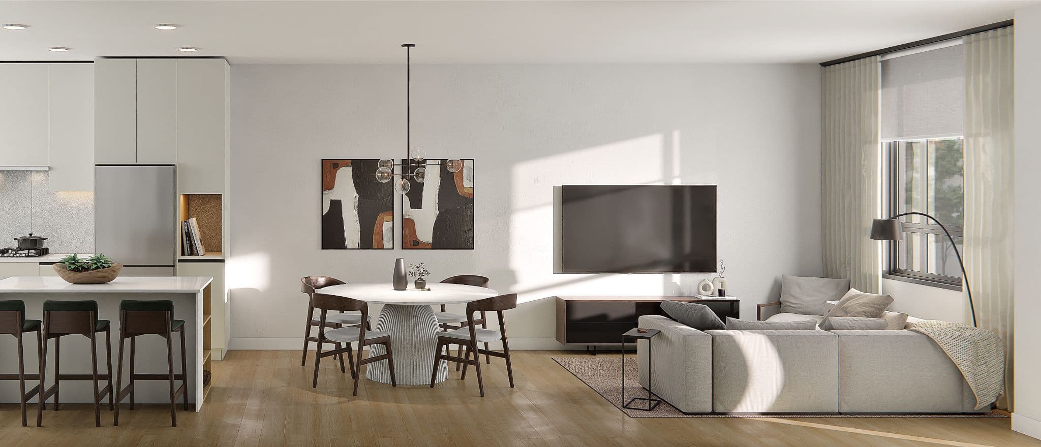 The Grove – An open-concept living and dining area with a round white dining table, dark wood chairs, abstract wall art, a wall-mounted TV, and a beige sectional sofa near a window.
