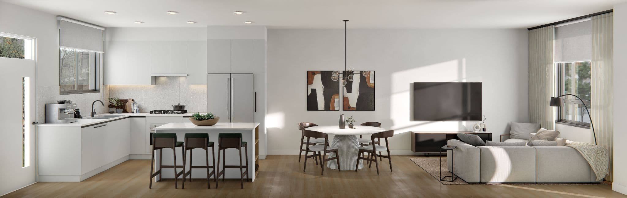The Grove – A wide panorama of an open-concept unit showing a white kitchen with island and green stools, a round dining table, and a living room with a sectional sofa and wall-mounted TV.