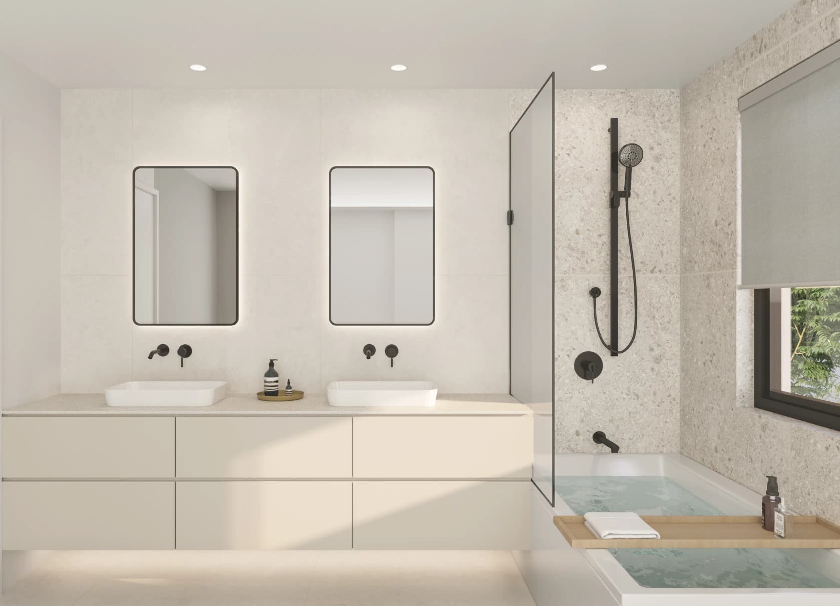 Emera – A modern bathroom featuring a floating off-white vanity with dual vessel sinks, matte black fixtures, and two backlit rounded rectangular mirrors. Adjacent to the vanity is a sleek built-in bathtub with a glass divider and textured terrazzo-style wall tiles under soft, bright lighting.