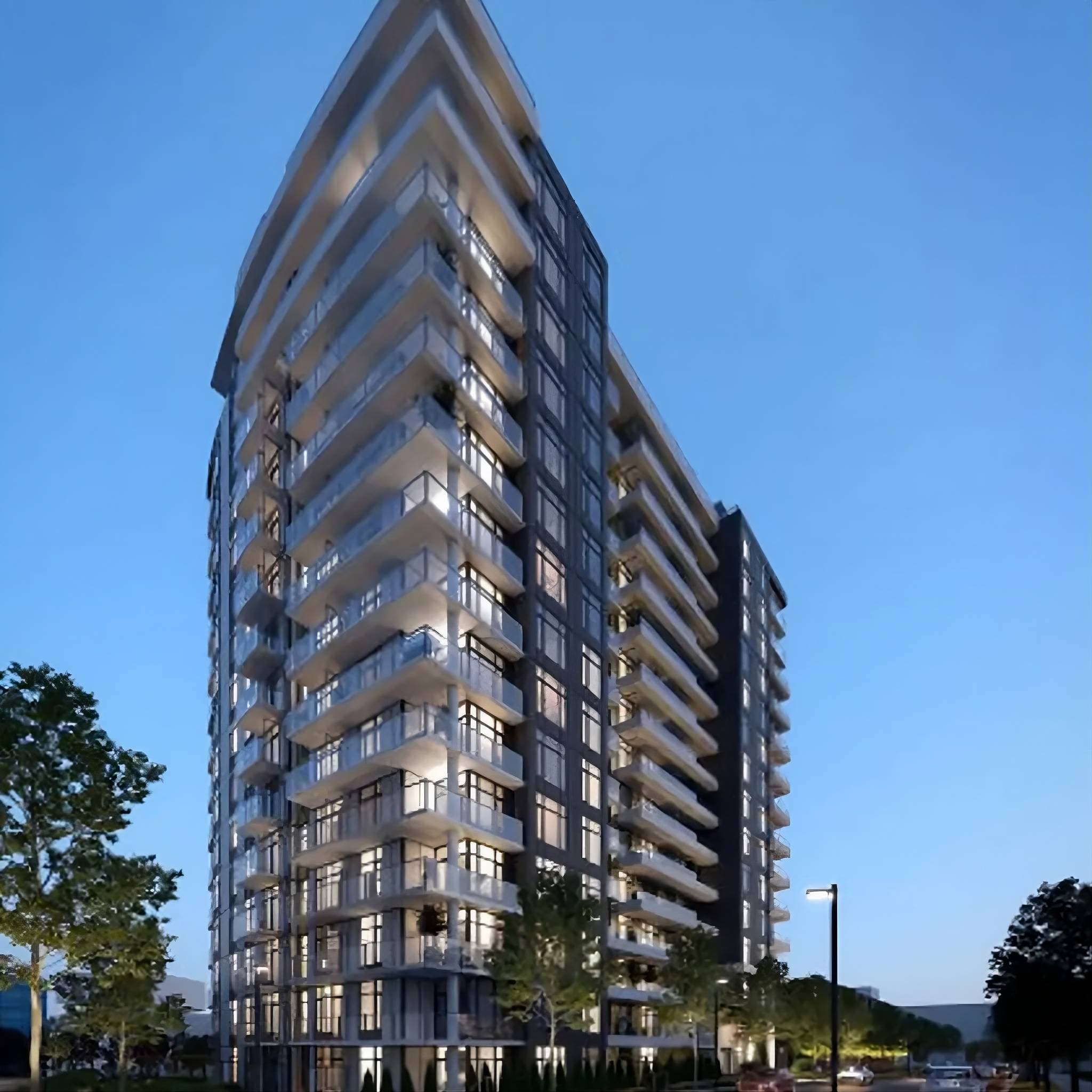 Wordsworth – A low-angle exterior shot of a modern, multi-story residential tower at dusk with illuminated windows and glass balconies. The facade combines dark panels with bright glass railings, set against a clear evening sky with trees and streetlamps lining the base.