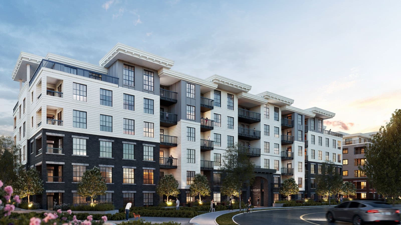 The Wright at Rail District – Dusk street-level rendering of a mid-rise condo building with brick and light siding, labeled Wright at the entrance.
