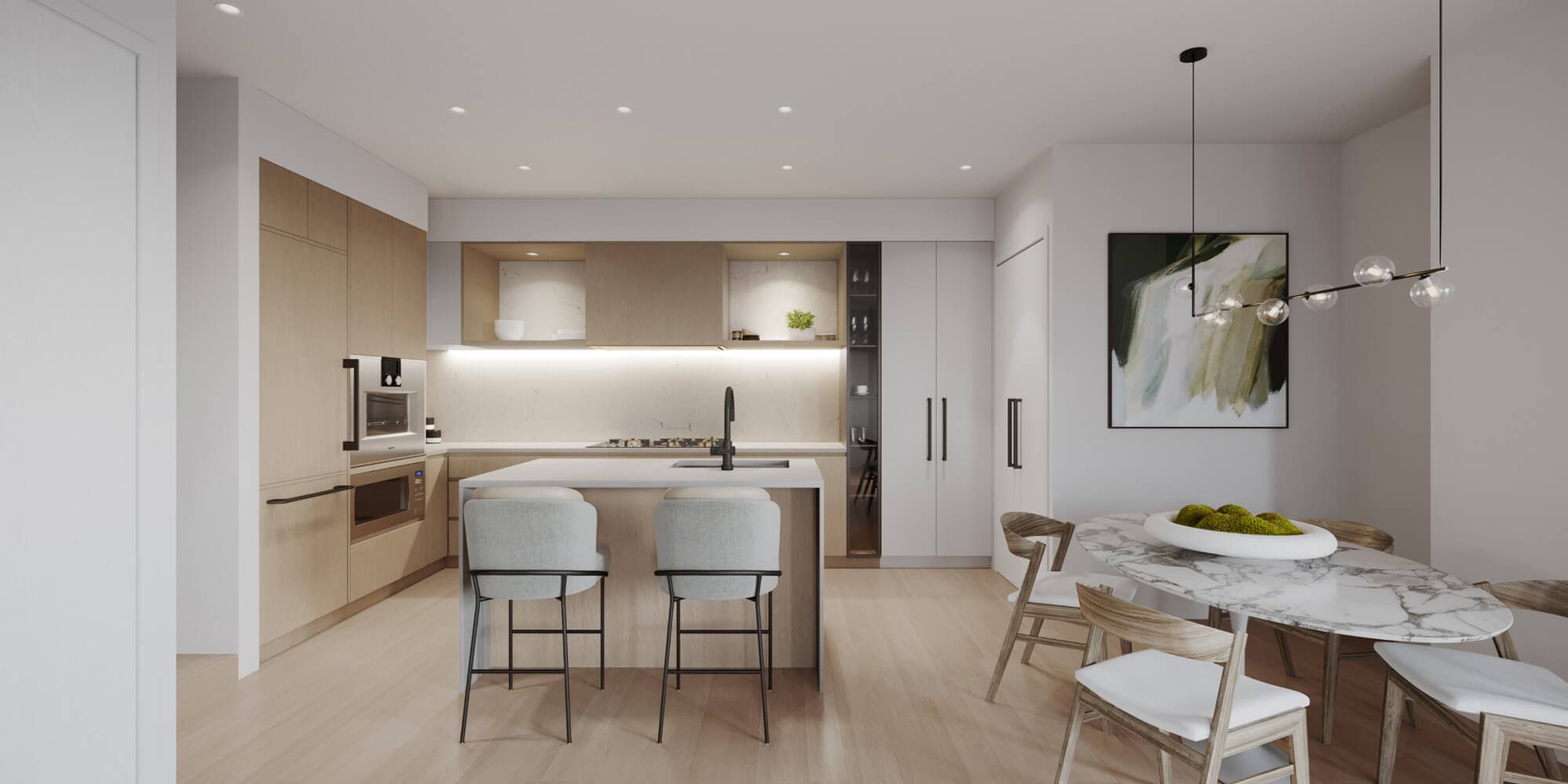 BE 49th – Open-concept kitchen with light wood cabinetry, an island with grey stools, and an adjoining dining area with a marble table and abstract art on the wall.