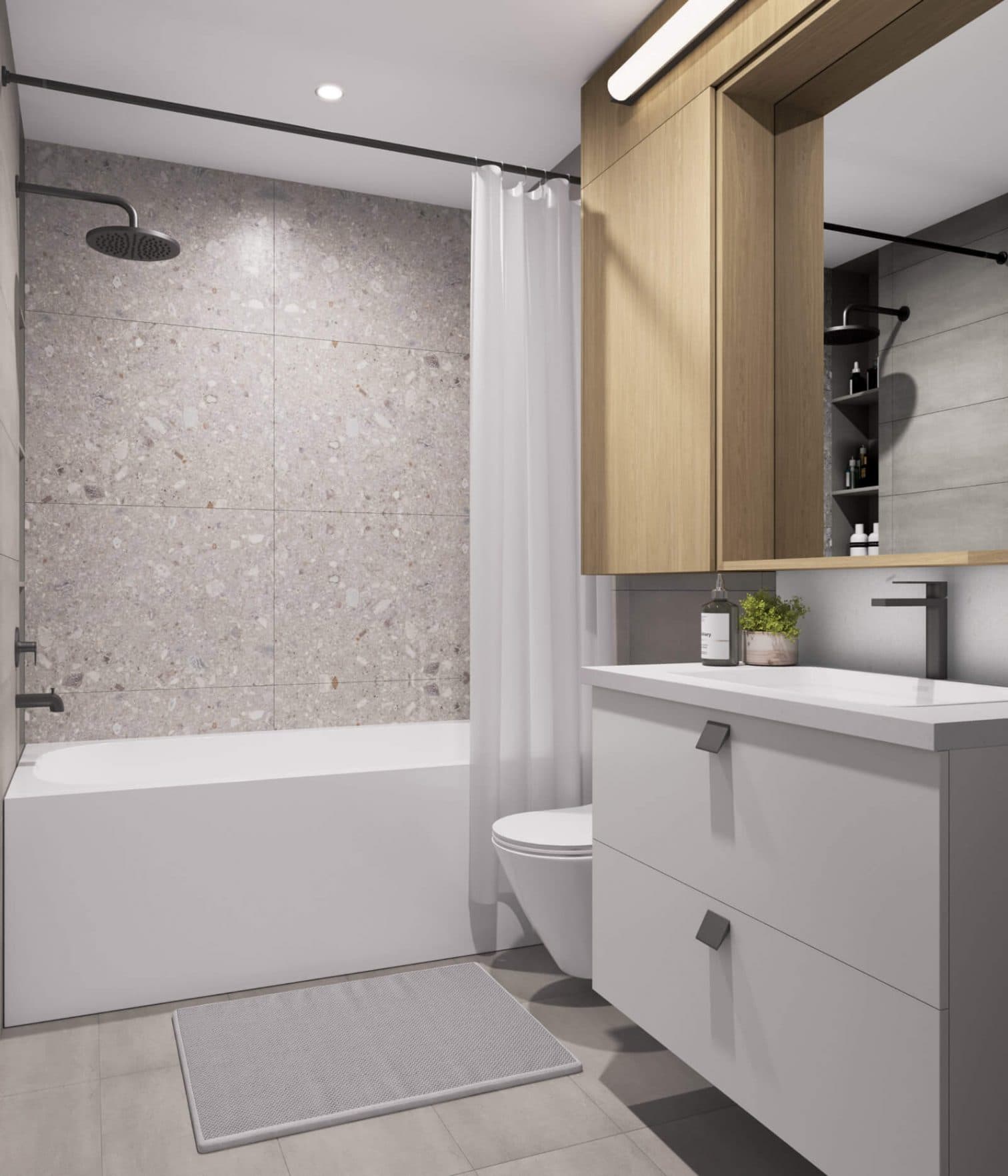 BE 49th – Bathroom with a terrazzo-tile tub-shower combo behind a white curtain, wall-mounted toilet, and a wood vanity with mirror to the right.