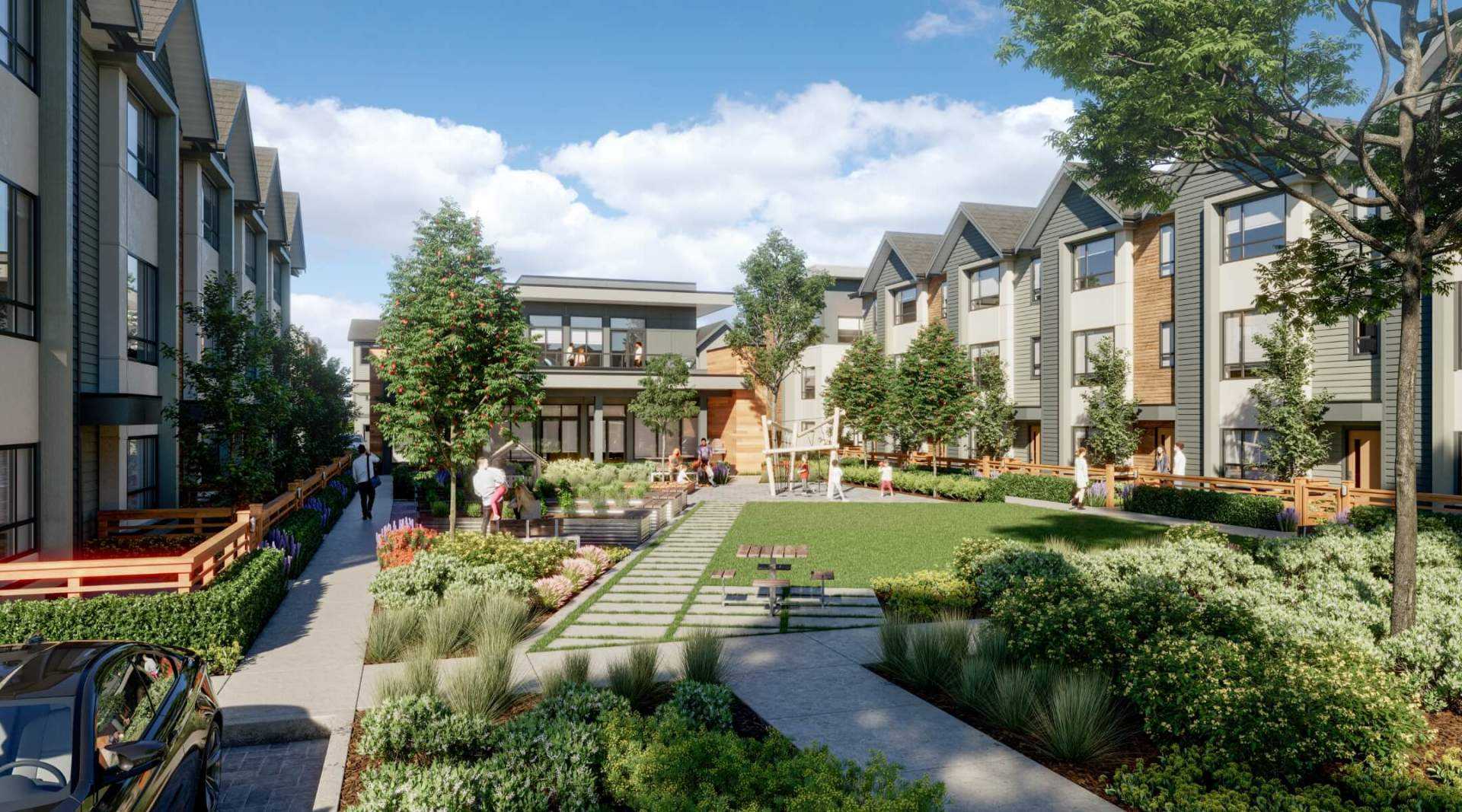 Highstreet Village – Landscaped shared courtyard between townhome buildings with a lawn, picnic tables, and a children's play structure.