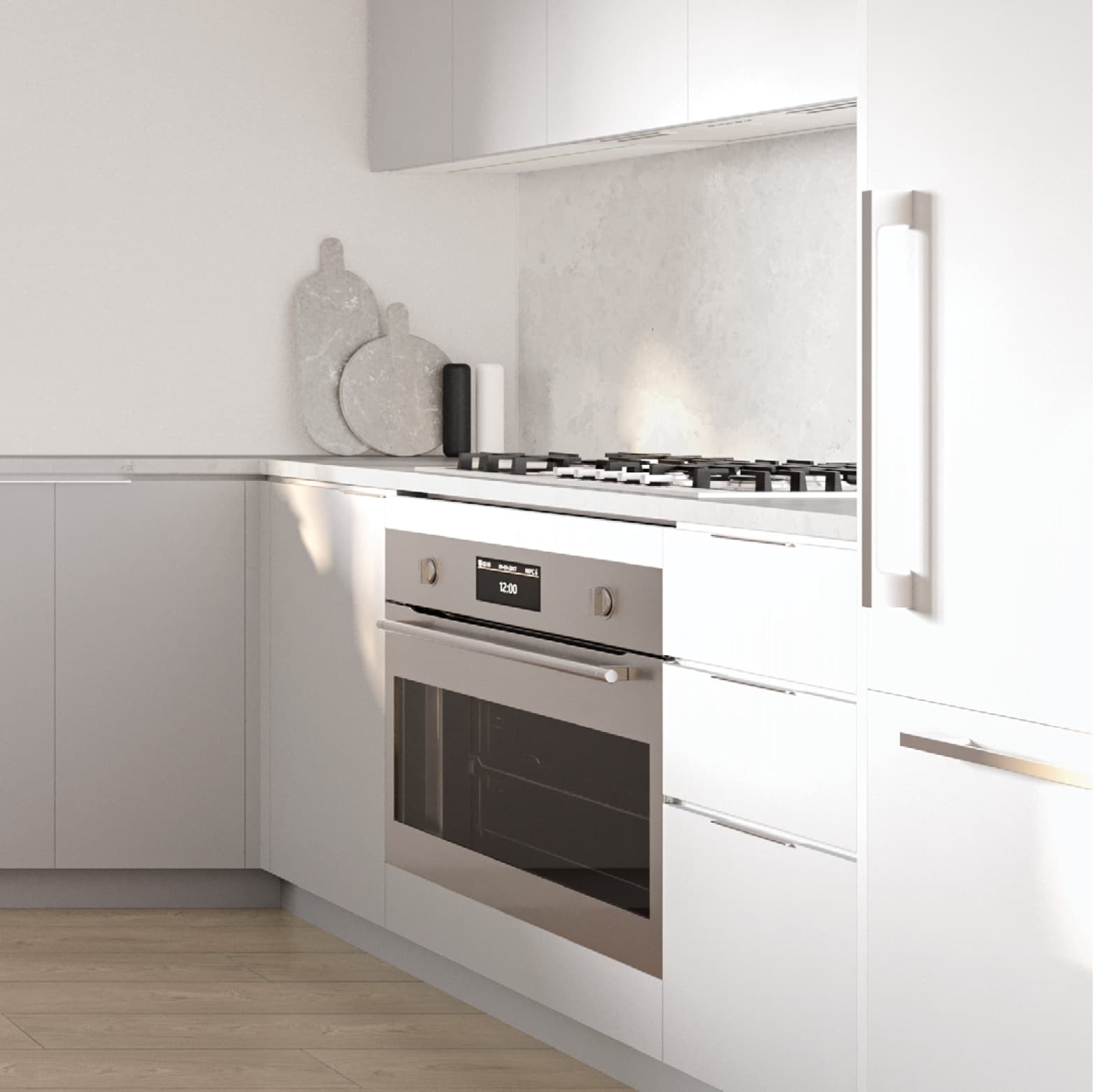 South Yards – Close-up of a white kitchen corner with a built-in oven with digital display, gas cooktop, stone backsplash, and marble cutting boards leaning against the wall.