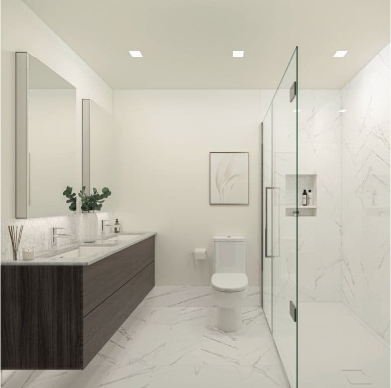 Lakewood – A bathroom with a glass-enclosed shower, marble tile, double vanity with dark wood cabinetry, and a mirror with sconce lighting.