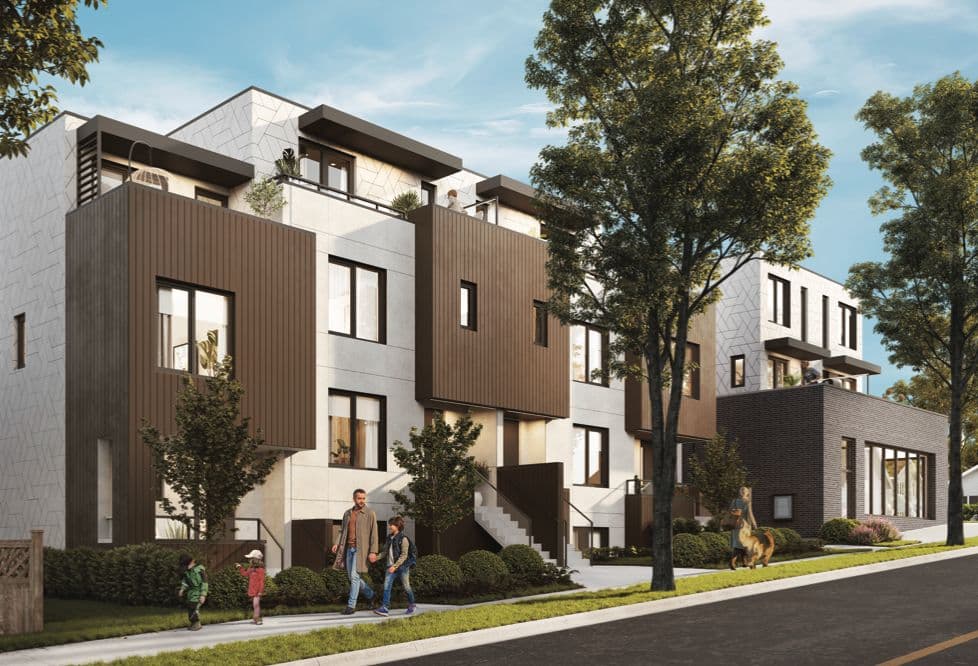 Lakewood – Street-level daytime view of modern townhomes with light stone facades, dark wood accents, rooftop patios, and a family walking a dog outside.