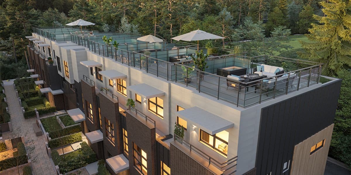 27North – Aerial dusk view of rooftop terraces with umbrellas and outdoor furniture atop a row of townhomes.