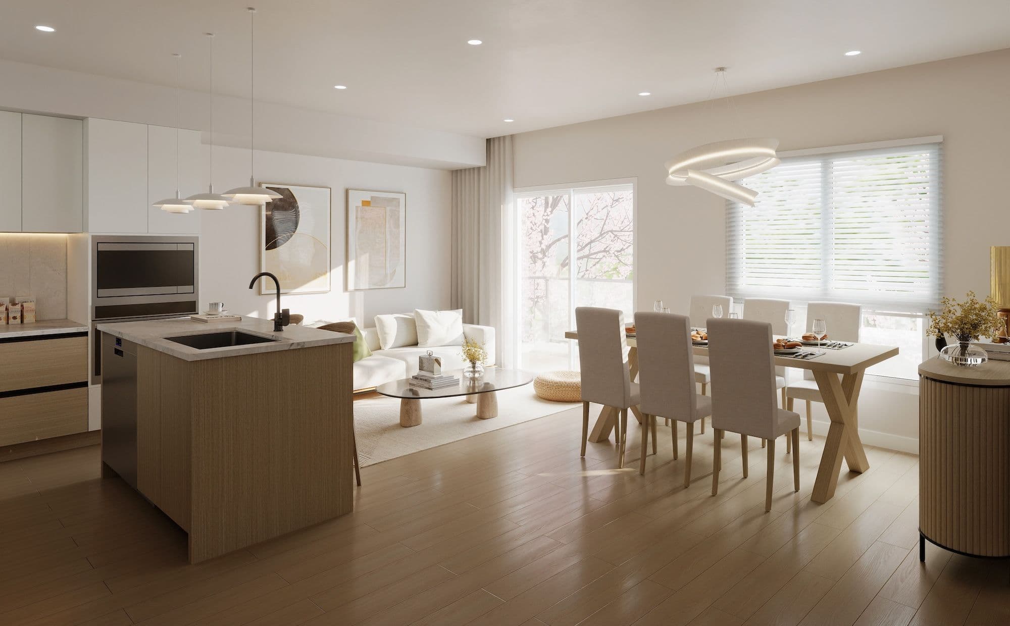 Kamilia – An open-concept living, dining, and kitchen area finished with light wood floors, neutral walls, and minimalist contemporary furnishings. Natural daylight streams through a sliding glass balcony door and large window, illuminating a kitchen island, a six-person dining table, and a cozy lounge space.
