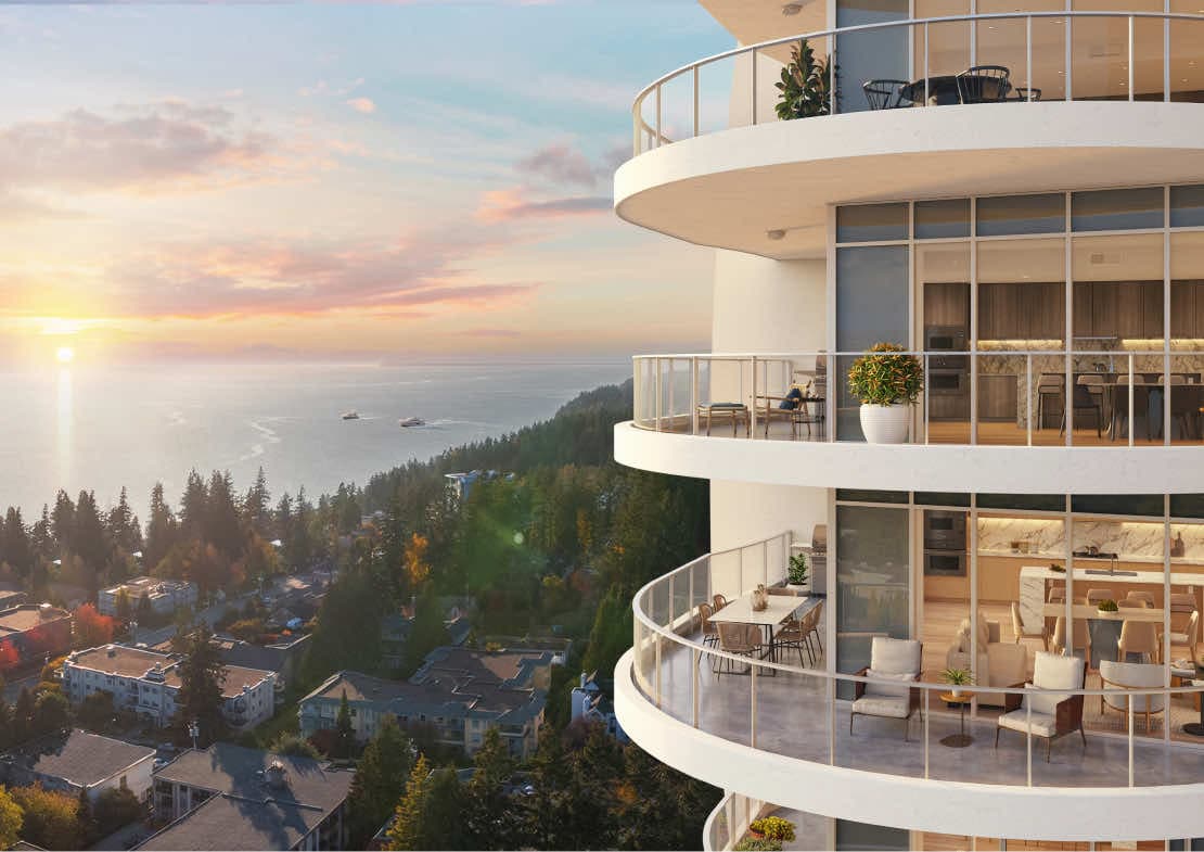 Foster Martin – A high-angle perspective showcases the curved exterior balconies of a high-rise tower overlooking a forested coastal neighborhood and the open sea at sunset. Golden sunlight reflects on the ocean water as boats sail in the distance, while warmly lit suite interiors and furnished terraces are visible through floor-to-ceiling glass.