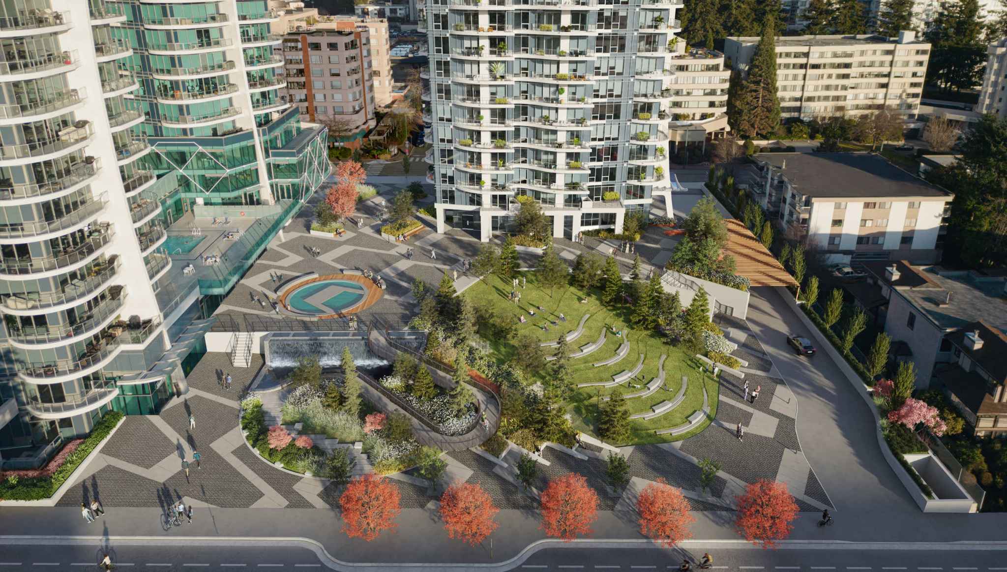 Foster Martin – An elevated bird's-eye view showcases a modern residential plaza nestled between curved glass high-rise towers, complete with patterned stone pavers, a circular water feature, and a waterfall. The landscaped outdoor space includes terraced lawn amphitheater seating, lush pine trees, autumn-colored foliage, and people strolling through the pedestrian-friendly grounds under bright daylight.